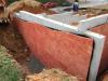 These below-grade walls are insulated along the exterior with R-5 of bug-resistant high-density rigid fiberglass insulation installed over damproofing. 