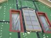 The rough openings for the windows are flashed with a paint-on flashing product then the windows are installed and additional flashing tape is installed over the flashing. Nail holes are sealed with caulk.