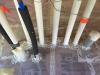 Plumbing penetrations through the below slab insulation are sealed with tape and spray foam.
