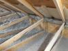 Right - Baffles above the raised heel trusses and wind dams behind the trusses will keep wind from blowing the cellulose insulation away from the eaves.  