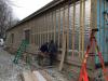 Furring strips are installed over a foil-faced rigid foam sheathing to provide a drainage plane and ventilation gap behind siding.