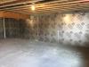 Right - The conditioned basement is insulated on the interior with 1 inch of polyiso R-6.3 rigid insulation.