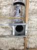 Right – Open-cell spray foam fills the attic floor joists.