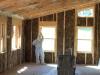 Right – Windows are being caulked after installation.