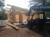 Right – Structural insulated panels are quickly assembled on site for this SIP house.