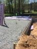 Right – The raised slab foundation has a 3-ft stem wall of filled concrete block, then is back-filled with compacted dirt and crushed rock, then insulated with 1” rigid foam covered with taped vapor barrier, under a floor slab.