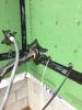 Right – A flexible tape is used to air-seal around wiring holes in the coated sheathing.