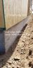 Right – This wall is constructed with the sill plate overhanging the top of the foundation wall so that when rigid foam is installed on the exterior of the foundation wall, its surface will align with the surface of the wall sheathing.