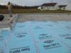 Right – After installing the insulated concrete foundation wall panels, the builder installed underslab rigid foam, which was topped by 4 inches of crushed rock then the poured slab.