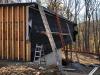 Larsen trusses made of 9-inch I joists, set perpendicular to the exterior wall at 16 inches on center, provide a second wall cavity that can be filled with blown insulation, greatly increasing the insulation value in the walls. 