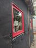 Right - Tape flashing keeps moisture out around and below the window; extra tape reinforces the corners to prevent tearing of the house wrap and to keep water out of this critical juncture. 