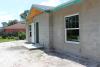 Right – This hot-humid climate home is constructed with concrete block that is insulated on the inside with rigid foam; the framing is borate-treated lumber; the roof design is a high-wind-resistant hip roof with only one small gable over the entry.