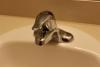 Right – The PEX piping and sink drain of this bathroom sink are fitted with escutcheons that help to air seal around the pipes and prevent pest entry.