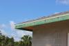 Right – This hot-humid climate home employs several hurricane- and termite-resistant features including concrete block construction, borate-treated framing, a hip roof design with metal drip edge, impact-rated windows, and an unvented attic. 