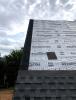This roof was constructed to meet the IBHS Fortified Roof standard by sealing the decking seams with flashing tape, installing synthetic roof underlayment secured with metal drip edge and nailed every six inches, and using self-adhered starter shingles. 