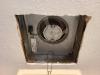 The jagged edges of the cutout around this ceiling exhaust fan require canned spray foam, metal tape, or fiberglass mesh tape and mastic to air seal the gaps and keep conditioned air from the home from escaping into the attic 