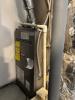 This is an ambient atmospheric-combustion furnace that pulls its combustion air from the room or space in which it is located in through an open grill on the front of the combustion chamber.