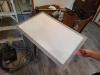 Weatherstripping has been installed along the edge of this attic access panel to air seal the opening.