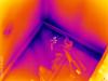 This infrared image shows cold air entering the home through leaks in the sill plate 