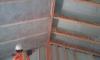 This builder applied an air-sealing layer of spray foam along the underside of the roof deck and the inside of the walls before filling the wall cavities with blown cellulose.
