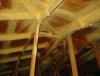 Right – Closed-cell polyurethane foam is sprayed on the underside of the roof deck to provide structural connections and seal seams in the sheathing to increase wind resistance