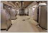 This mechanical room contains both the storage tanks (right) and heat pumps (left) of a central heat pump water heating system