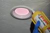 Caulk around recessed can and new LED retrofit ceiling light kits to complete the air seal.