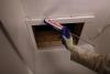 Caulk around the trim of the attic access panel or door to improve the air sealing between the living space and the attic.