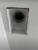 With the register grill removed, very large gaps are visible around the edges of this duct boot between the duct boot and the drywall; the gaps can be closed with screw or heavy staples then sealed with caulk, mastic, or metal tape.