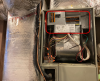 This upflow air handler for a traditional heat pump has an electric resistance auxiliary heating element located at the top of the unit (circled in red).