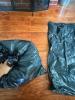 After inserting pillows in the first garbage bag, squeeze out excess air before inserting it in the second bag and then into the fireplace to air seal the flue