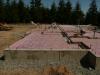An ultra-efficient layer of R-20 rigid foam foundation insulation covers the ground underneath the vapor barrier and radiant floor loops, which will circulate water heated by an ultra-efficient geo heat pump. 