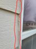 The exterior caulking around this window is clearly cracked, indicating that the caulking is no longer performing well and should be replaced.