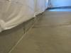 Caulk the seam between the slab and foundation wall