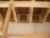 Use caulk or spray foam to air-seal all four edges of the blocking material in each joist bay.