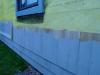 Drainage behind wood shingle cladding is provided by a 3/8-inch-thick drainage mat.