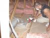 Duct boots and other ceiling penetrations are air-sealed using spray foam