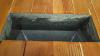 The seam between this duct register and the wood flooring is sealed with caulk to prevent air leakage into the house from the crawlspace below.