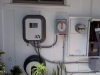 This EV charger is located near the home’s electrical panel and a time-of-use (TOU) meter. 