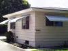 The window awnings on this house provide a simple but very effective way to reduce solar gains while still allowing view, daylight, and ventilation through the windows