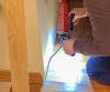 Use a gun-type applicator for greater control when installing canned spray foam to the wall-to-slab seam.