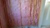 Wrong - Unfaced fiberglass batt is not properly cut to fit in all the stud bays.