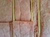Wrong - Fiberglass insulation is poorly installed in wall cavities.