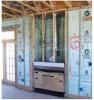 Rigid foam insulates the interior of masonry walls behind the fireplace in this Building America home by Castle and Cooke in Winter Garden, Florida.
