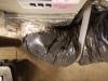 Wrong - Flex duct insulation is overly compressed in 3 ways; Zip-tie fastener is over the insualtion not under the insulation at the duct boot collar, duct turning radius is too tight, and support strap is too tight.