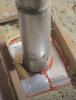 . Install sheet metal to cover the gaps around a flue pipe in the attic; attach with screws or heavy staples, then seal seams with fire-rated caulk or foam
