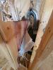 Wrong - Foil air barrier was ripped to install wiring; foil should be replaced with a solid air barrier and wiring hole should be caulked.