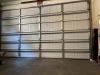 This bottom seal on this garage door looks fairly tight, except in the right corner where there is 4-inch gap.