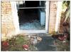 The unprotected glazing in this door was broken by roof tiles dislodged by wind. 