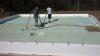 The floor slab is completely insulated with ICF foundation walls and R-20 (3 inches) of closed-cell foam that is sprayed directly onto the ground before pouring the slab. 